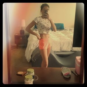 cherry print crop top and orange fitness shorts